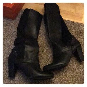 Black boots with spandex backing. Never worn.